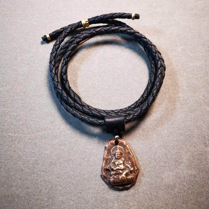 Yellow Jambhala Pendant - Tibetan Buddhist art, detailed view