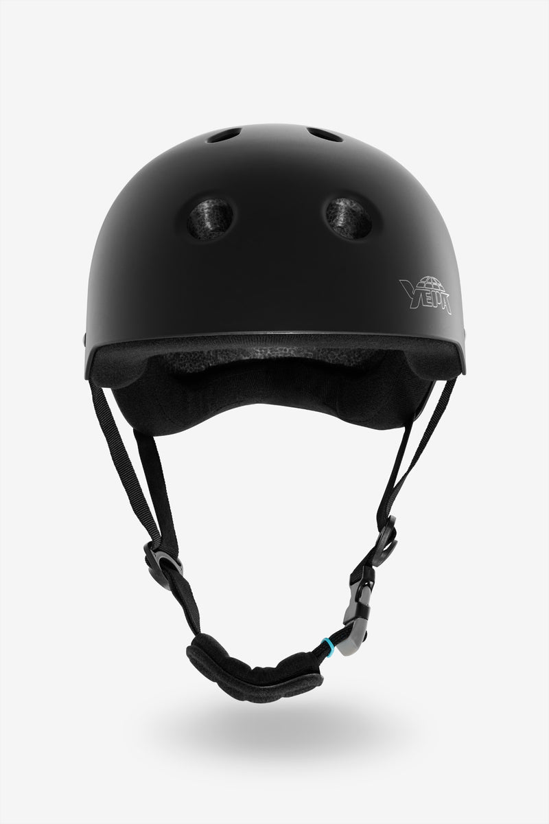 YEPA T-Shell matte black helmet shown from side with visible foam padding and chin strap