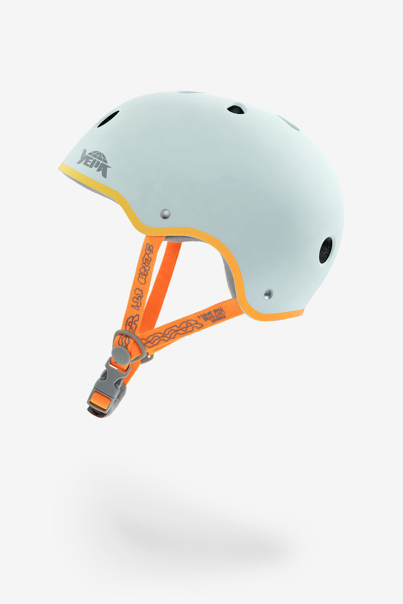 Three-quarter view of light blue YEPA T-Shell Plus helmet with yellow edge and orange straps