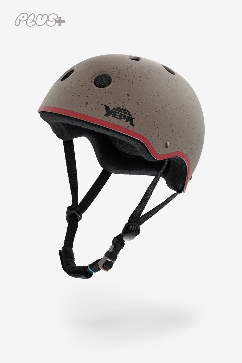 Stone speckled YEPA helmet with red trim and black adjustable straps.