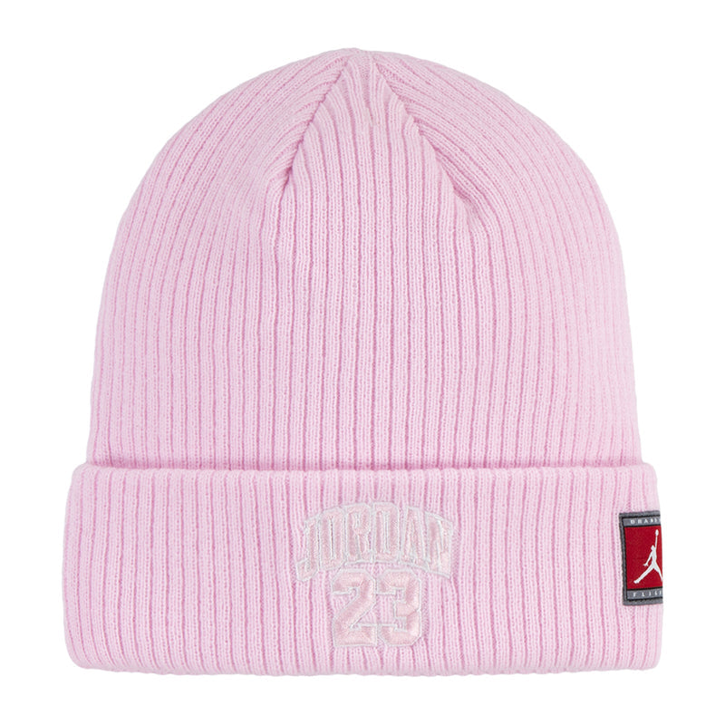 Pink ribbed youth beanie with raised Jordan logo and side brand tag