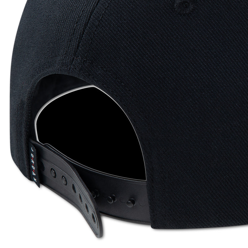 Black youth dad cap with open side panel and snapback eyelets