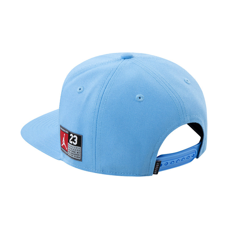 Youth light blue snapback cap with side Jordan patch and curved flat brim