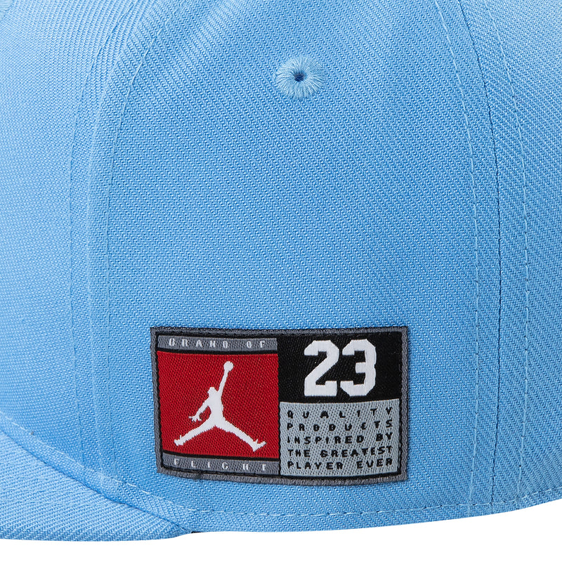 Youth blue snapback cap close-up of embroidered Jordan 23 front patch