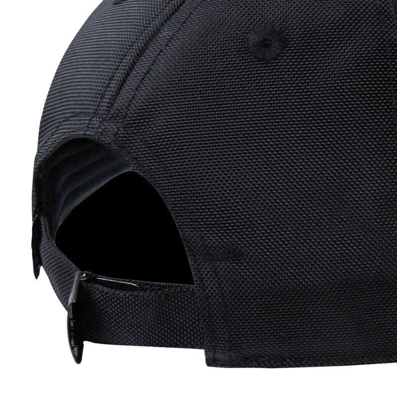 Black cap side view showing interior lining and eyelet vents